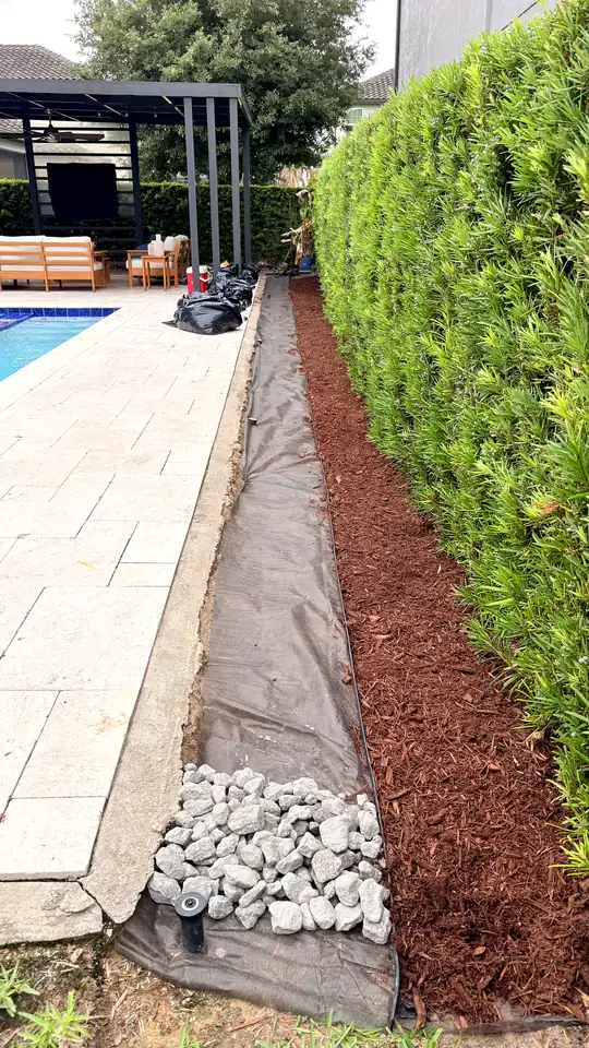 Mulch spread over the fabric